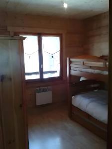 Postel nebo postele na pokoji v ubytování Chalet Le Flocon