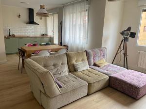 a living room with a couch and a table at Los tucanes in Haro