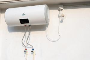 a hair dryer on the wall of a room at The Serenity Space in Pātan