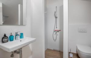 a white bathroom with a shower and a sink at Rab Barbat Villas 4 stars 300 sea in Barbat na Rabu