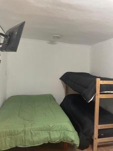 Ένα ή περισσότερα κρεβάτια σε δωμάτιο στο Depto Jose Hernandez Loft