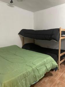 Ένα ή περισσότερα κρεβάτια σε δωμάτιο στο Depto Jose Hernandez Loft