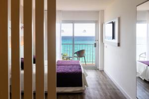 Postel nebo postele na pokoji v ubytování Hotel Brisa Marina