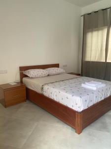 Postel nebo postele na pokoji v ubytování Laranjinha Rooms