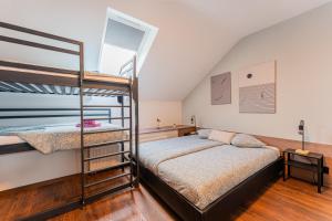 a bedroom with two bunk beds and a window at Flexible SelfCheckIns 122 - Zagreb - Bedroom - Loggia in Zagreb