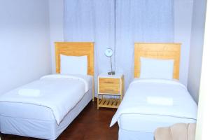 Postel nebo postele na pokoji v ubytování Suprime Hotels and Conference