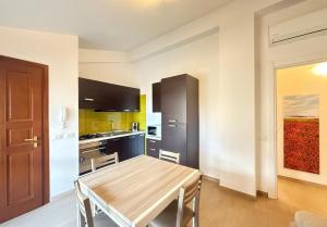 a kitchen with a wooden table in a room at Semplice BnB Bonagia in Valderice