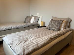Postel nebo postele na pokoji v ubytování Heima at Selfoss