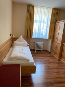 Postel nebo postele na pokoji v ubytování Hotel Klosterhof