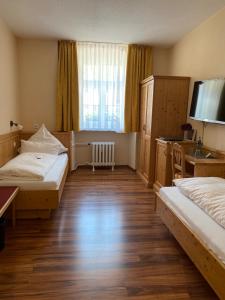 Postel nebo postele na pokoji v ubytování Hotel Klosterhof