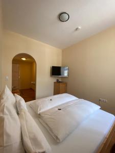 Postel nebo postele na pokoji v ubytování Hotel Klosterhof