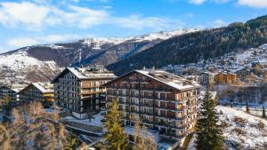 an aerial view of a building in the mountains at Rossignol C3 - 4 pers - vue magnifique in Nendaz