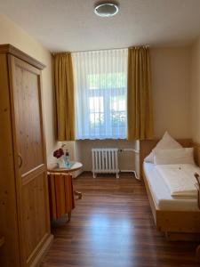 Postel nebo postele na pokoji v ubytování Hotel Klosterhof