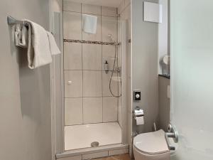 Koupelna v ubytování DORMERO Hotel Coburg + 29 fotografií