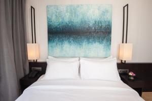 Katil atau katil-katil dalam bilik di GLOW PARK HOTEL Grand Royal Palace