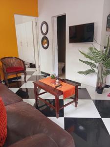 a living room with a couch and a table at Orange Leaf Unit 1 in Durban