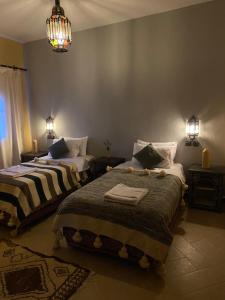 Cama o camas de una habitación en Kasbah Erg Chebbi