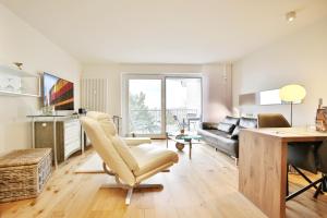 Televisyen dan/atau pusat hiburan di Strandschlößchen Strandschlösschen Appartement 27