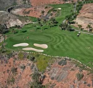 an aerial view of a golf course on a mountain at Maspalomas Pasito Blanco N in Pasito Blanco