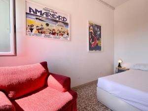 Ένα ή περισσότερα κρεβάτια σε δωμάτιο στο Trilocale panoramico vicino al mare- L'Attico sulla Romagna +25 φωτογραφίες