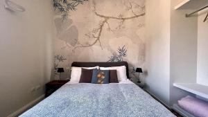 A bed or beds in a room at Santonofrio SKY Terrace Penthouse