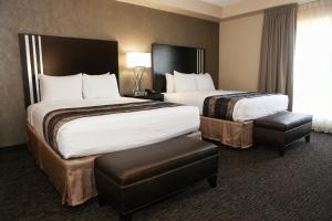 a hotel room with two beds and a window at Grand Legacy At The Park in Anaheim