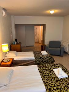 Postel nebo postele na pokoji v ubytování Budget Hotel Easystay
