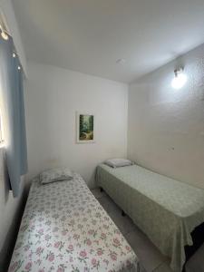 a bedroom with two beds in a room at Hotel e Pousada dos Leões in São Luís +15 photos