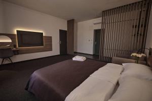 Postel nebo postele na pokoji v ubytování UNGVARSKIY Thermal Hotel + 37 fotografií