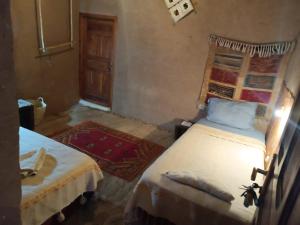 Un ou plusieurs lits dans un hébergement de l'établissement Kasbah Oulad Othmane