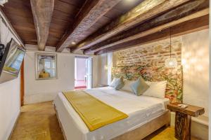 Postel nebo postele na pokoji v ubytování Bololá Hotel