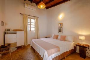 Postel nebo postele na pokoji v ubytování Bololá Hotel + 37 fotografií