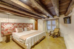Postel nebo postele na pokoji v ubytování Bololá Hotel