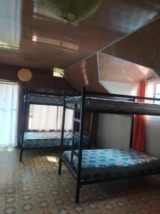 Voodi või voodid majutusasutuse Hostal Ojo de Agua toas
