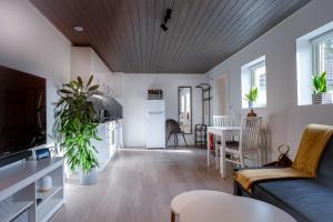 a living room with a couch and a table at KS Apartment Modern & cozy flat 20 min from Bergen centre in Espeland