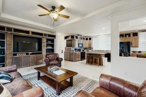 a living room with a couch and a table at Water's Edge Escape in Chelan