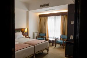 Postel nebo postele na pokoji v ubytování Hotel Sao Jose