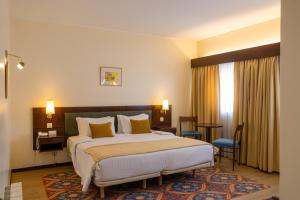 Postel nebo postele na pokoji v ubytování Hotel Sao Jose
