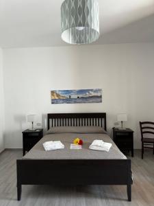 Posteľ alebo postele v izbe v ubytovaní Holiday Home Tarinuzza