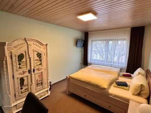 Postel nebo postele na pokoji v ubytování Eiscafé - Pizzeria Antonio