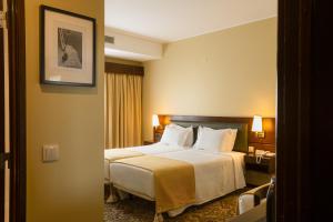 Postel nebo postele na pokoji v ubytování Hotel Sao Jose
