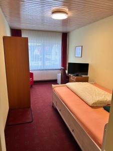 Postel nebo postele na pokoji v ubytování Eiscafé - Pizzeria Antonio