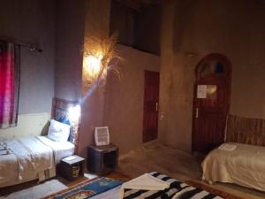 Un ou plusieurs lits dans un hébergement de l'établissement Kasbah Oulad Othmane