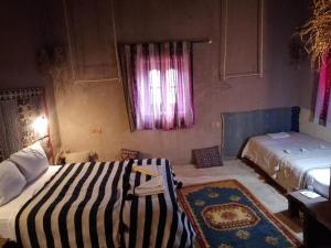 Un ou plusieurs lits dans un hébergement de l'établissement Kasbah Oulad Othmane