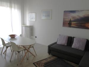 a living room with a table and a couch at casa dei ragazzi in Pavia