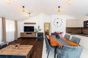 a kitchen and living room with a table and chairs at Sea View Apartment Betina, Murter in Betina