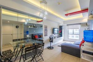 a living room with a glass table and a couch at Avida Riala Tower 2, IT Park, New Fully Furnished in Cebu City