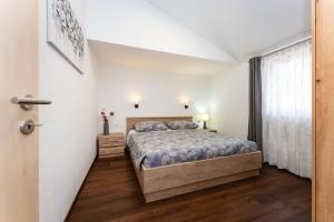 a bedroom with a bed and a window at Sea View Apartment Betina, Murter in Betina