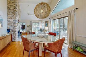 a dining room with a table and chairs at Parkside 4518 in Kiawah Island
