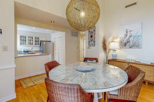 a kitchen and dining room with a table and chairs at Parkside 4518 in Kiawah Island